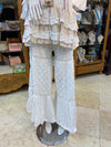White ruffle top and tiered pants set